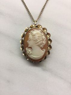 12k Shell cameo and chain made around 1920 in great condition. Antique Cameo Medallion Jewelry, Elegant Cameo Medallion Jewelry, Antique Cameo Yellow Gold Jewelry, Classic Cameo Necklace With Oval Pendant, Heirloom Style Cameo Medallion Necklace, Antique Yellow Gold Cameo Jewelry, Heirloom Cameo Pendant Jewelry, Classic Gold Cameo Jewelry, Heirloom Cameo Medallion Necklace