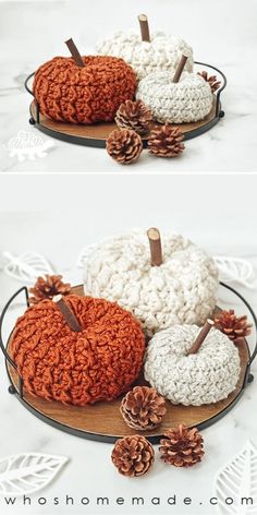 crocheted pumpkins on a plate with pine cones in the middle and one is made out of yarn