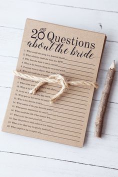 a brown paper with the words 20 questions about the bride written on it next to a pencil