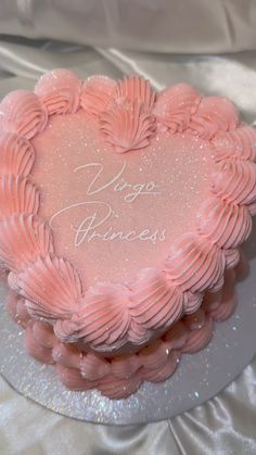 a heart shaped cake with the words yoga princess written on it's frosting