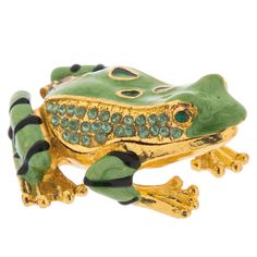 a frog brooch with green and black accents on it's back legs, sitting in front of a white background