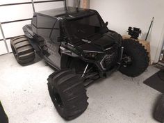 an off road vehicle parked in a garage