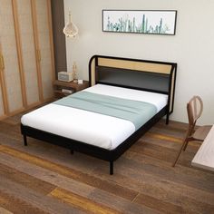 a bed sitting on top of a wooden floor in a bedroom