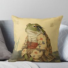 a frog dressed in traditional japanese clothing sitting on the ground throw pillow