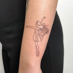 a woman's arm with a small tattoo of a ballerina dancer on it