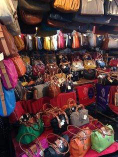 many purses and handbags are on display