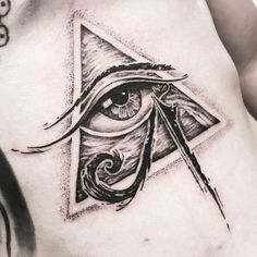 an all seeing eye tattoo on the chest