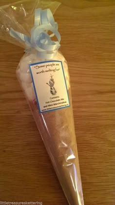 a plastic bag filled with bread on top of a wooden table