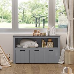 a child's room with toys, bookshelf and window in the background