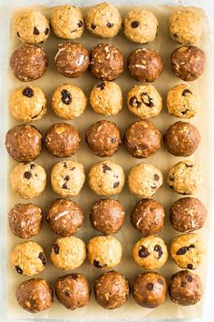 a baking tray filled with cookies and muffins