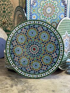 several colorful plates are sitting on the table