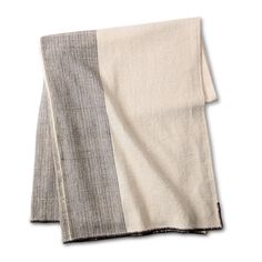 two tone linen napkins with black and white stripes on the front, one in grey and one in beige