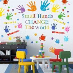 small hands change the world wall decal in a child's room with colorful hand prints