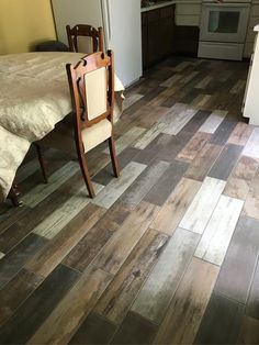 a kitchen and dining room with wood flooring in the middle of the living room