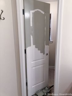 a white door with some paint on it in a room that is being remodeled by someone