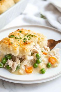 a white plate topped with chicken pot pie