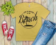 a t - shirt that says life is better at the beach