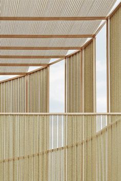 the inside of a building with wooden slats covering it's walls and floor