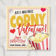 a valentine's day card with popcorn and a movie ticket on the front that says, just another corny valentine