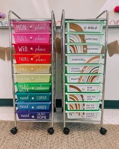 two metal racks with different colored labels on them and one has wheels for each drawer