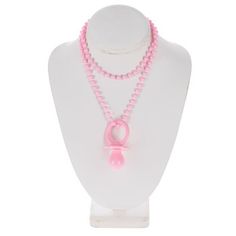 a white mannequin with pink beads and a necklace