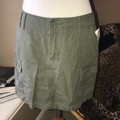 Olive/Army Green Cargo Skirt Nwt. 14” Waist To Hem. Perfect For Summer! Casual Skort With Side Pockets, Casual Stretch Cargo Skirt With Lining, Casual Short Cargo Skirt, Casual Fitted Cargo Skirt, Casual Green Mini Skirt With Pockets, Green Fitted Cargo Skirt, Green Fitted Casual Cargo Skirt, Casual Fitted Green Cargo Skirt, Casual Mini Cargo Skirt With Lining