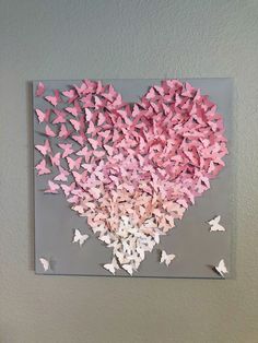 a heart made out of pink butterflies on a gray background with the word love written in it