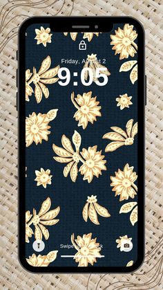 an iphone screen with gold flowers on it