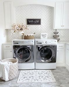 a washer and dryer in a white laundry room