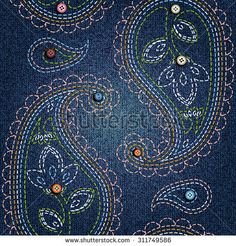 an image of a blue paisley pattern on denim fabric with buttons and sequins