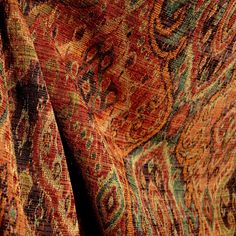 an orange and green paisley print fabric