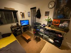 a living room filled with furniture and a flat screen tv