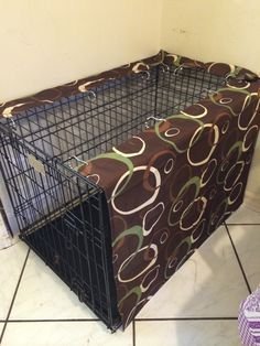 a dog crate with a cover over it