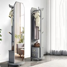 a room with a mirror, chair and coat rack