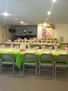 a table set up for a party with plates and napkins on top of it