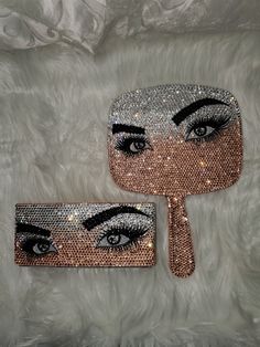 two mirrors with eyes and lashes on them