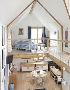 an instagramted photo of a living room and dining area in a loft apartment