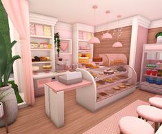 a pink and white bakery with lots of donuts