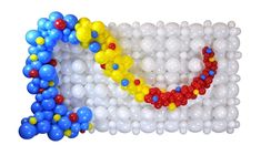 balloons are arranged in the shape of an olympic symbol on a white background with red, yellow and blue colors