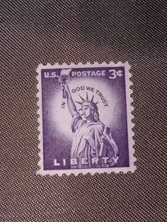 a postage stamp with the statue of liberty on it's back side is shown