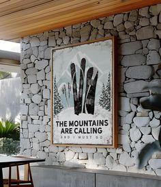 there is a sign on the wall that says the mountains are calling