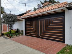 a house with a large garage door in front of it