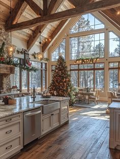 the kitchen is decorated for christmas and has large windows