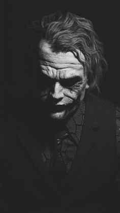 the joker in black and white with his face painted like it's from batman