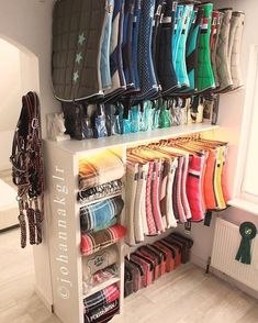 a rack with many pairs of shoes hanging on it