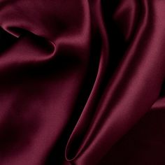 Introducing a top quality Premium Maroon Silk Solid Charmeuse made especially for Mood. Of a medium weight, this superb silk features an exquisite drape along with a lovely sheen. Silk charmeuse fabrics are the ideal material for classic gowns, dresses, blouses, and lingerie. They make superior linings as well. Available in 95+ attractive shades.   Note: Dye lots are subject to change up to 10% in either direction. Ordering swatches is HIGHLY recommended for these products. Maroon Aesthetic, Burgundy Aesthetic, Shades Of Maroon, Mood Designer Fabrics, Jewelry Logo Design, Royal Colors, Mood Fabrics, Sewing Material, Silk Charmeuse