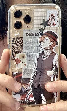 someone holding up their cell phone case with an image of a boy