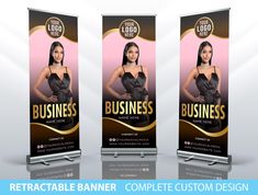 three roll up banners with a woman in black dress