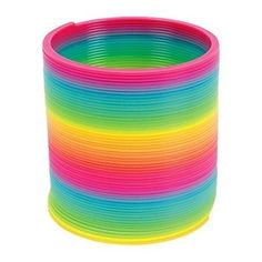 a stack of neon colored plastic bracelets on a white background with the colors of rainbow