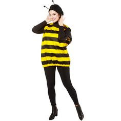 a woman in a bee costume is talking on her cell phone while standing against a white background